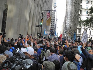 Police meet protesters at the intersection of Broadway and Wall Street