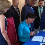 Gov. Gina Raimondo signing the Community-Police Relationship Act