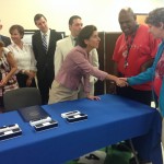 Gov. Raimondo shaking hands with Cornerstone students
