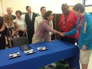 Gov. Raimondo shaking hands with Cornerstone students