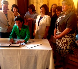 Gov. Raimondo signing bill to give Sec. of State Gorbea authorization to buy new voting equipment.