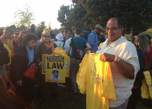 A man from Boston seems quite pleased with his new shirt. There were many Trayvon Martin signs at the march.