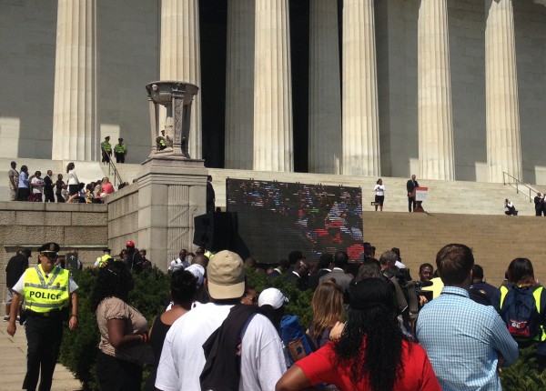 Attorney General Eric Holder speaking from the steps of the Lincoln Memorial. 