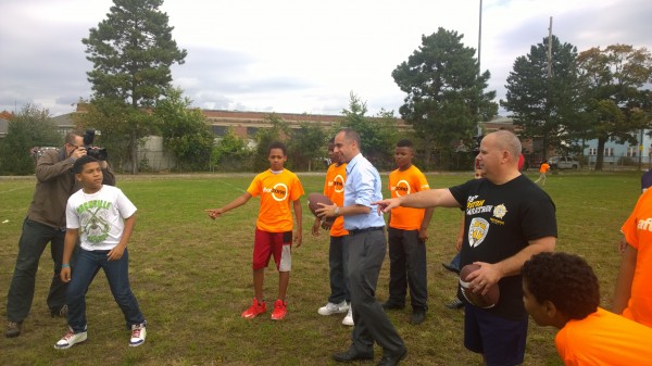 Mayor Jorge Elorza playing catch with After Zone students.