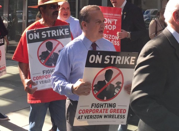 Congressman David Cicilline marching with Verizon workers earlier this week.