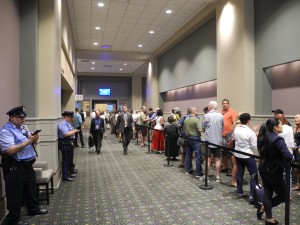 Interested audience members line up outside the Rules Committee meeting.