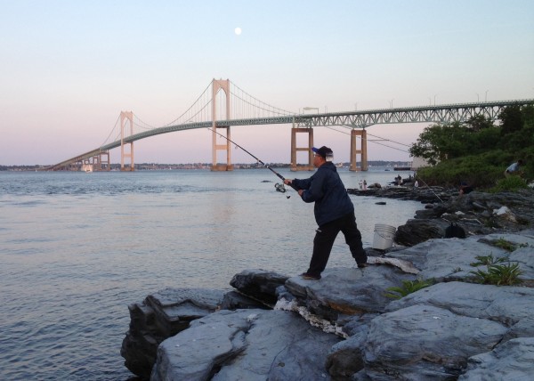 A man casts from the rocks.