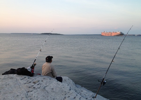 Watching a tanker go out to sea.